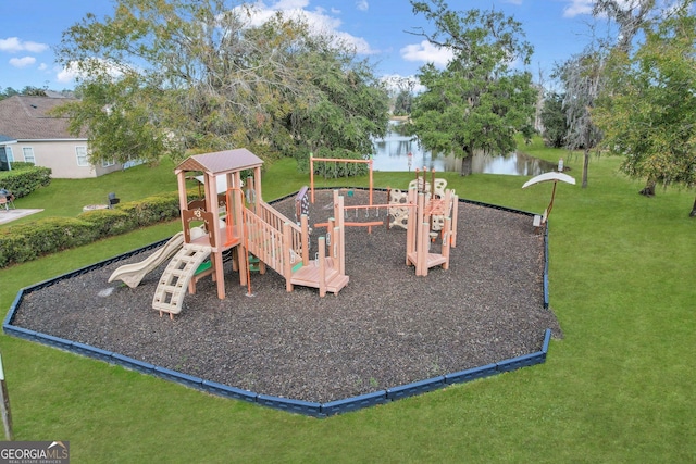 community play area with a yard and a water view