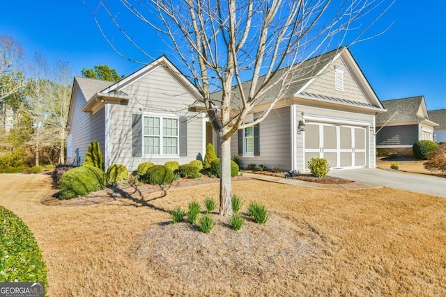 single story home featuring a garage and concrete driveway