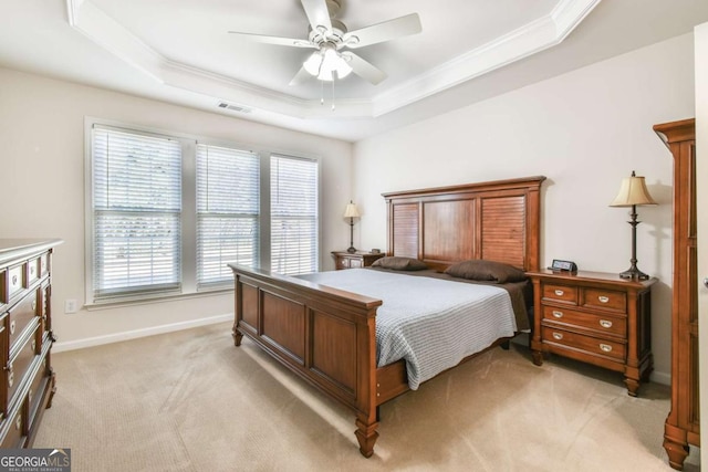 bedroom featuring a raised ceiling, visible vents, ornamental molding, light carpet, and baseboards