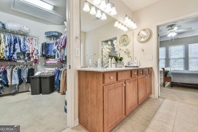 full bath with visible vents, ceiling fan, tile patterned flooring, a spacious closet, and vanity