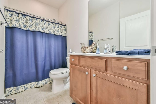 full bath with curtained shower, tile patterned flooring, vanity, and toilet