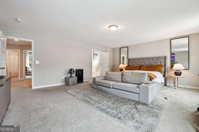 bedroom with light carpet and baseboards