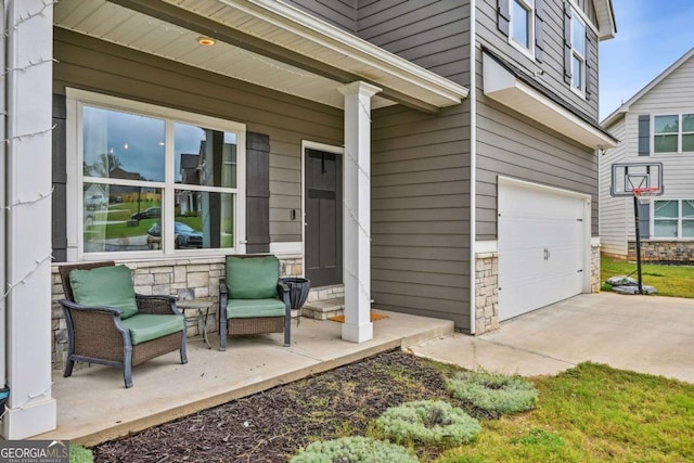 exterior space with a garage and stone siding