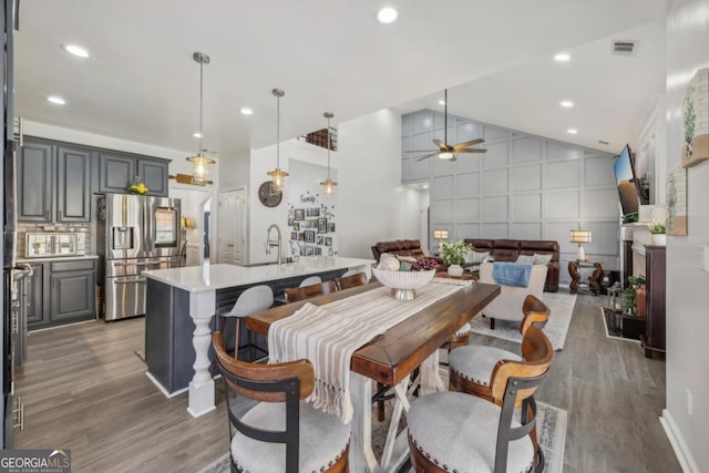 dining area featuring light wood-style floors, visible vents, a ceiling fan, and recessed lighting