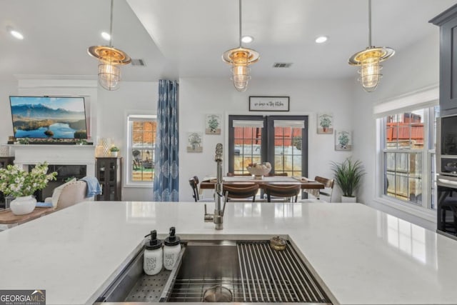 kitchen with french doors, visible vents, and a healthy amount of sunlight