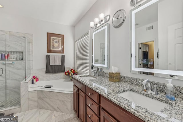 full bathroom with a bath, a stall shower, a sink, and visible vents