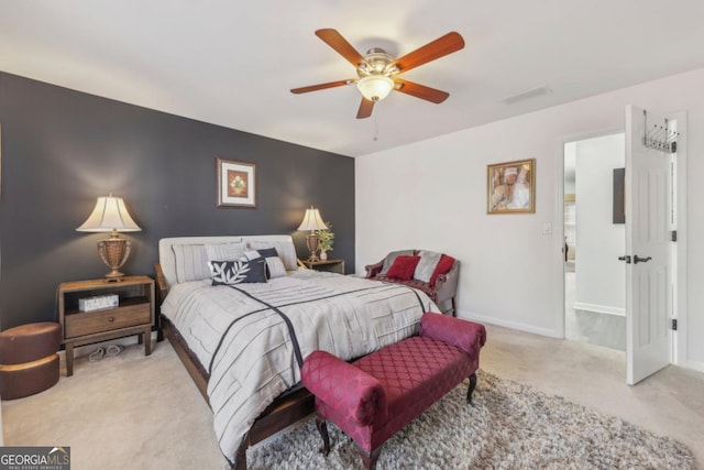 carpeted bedroom with ceiling fan, visible vents, and baseboards