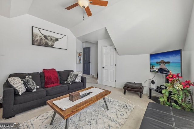 living room featuring vaulted ceiling and a ceiling fan