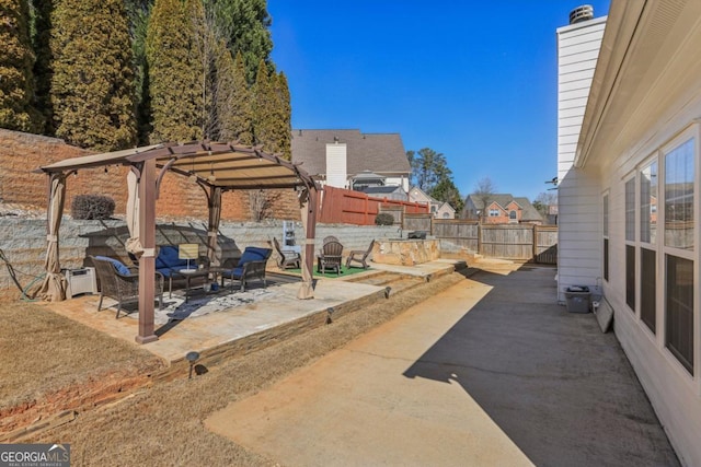 view of patio / terrace featuring a fenced backyard and a pergola