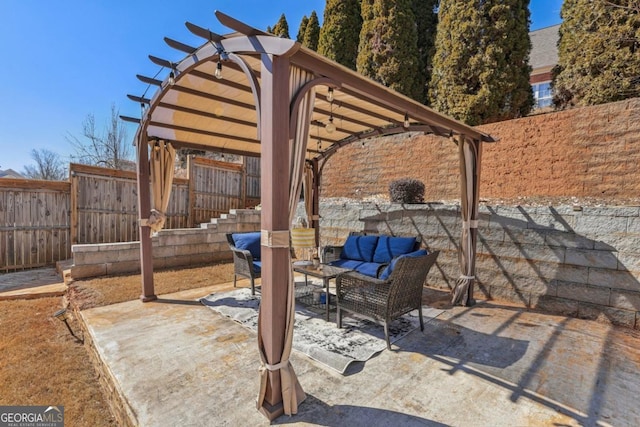 view of patio featuring a fenced backyard, outdoor lounge area, and a pergola