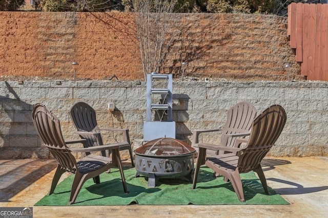 view of patio / terrace featuring a fire pit