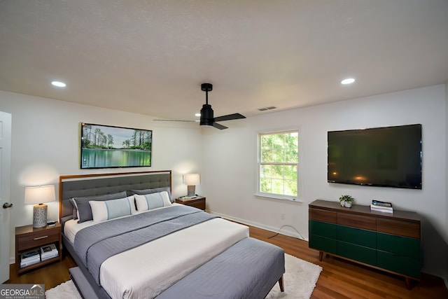bedroom with visible vents, ceiling fan, recessed lighting, and wood finished floors