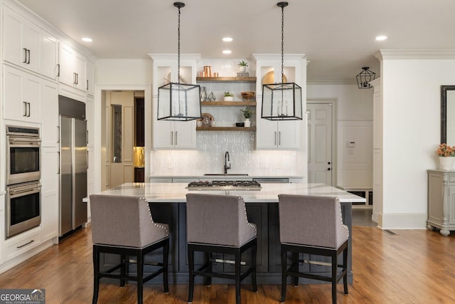 kitchen with open shelves, tasteful backsplash, appliances with stainless steel finishes, and white cabinetry