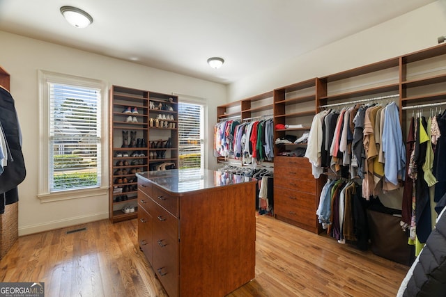 spacious closet with visible vents and light wood-style flooring