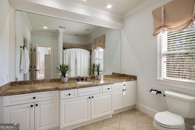 bathroom featuring tile patterned floors, toilet, ornamental molding, and vanity