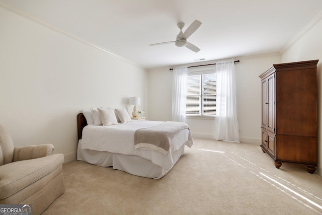 bedroom with visible vents, light carpet, ornamental molding, a ceiling fan, and baseboards