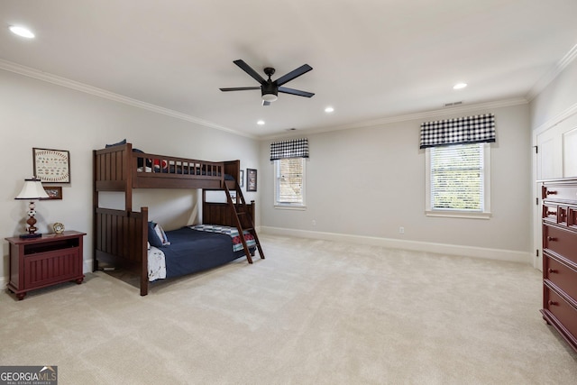 bedroom with light colored carpet, crown molding, baseboards, and multiple windows