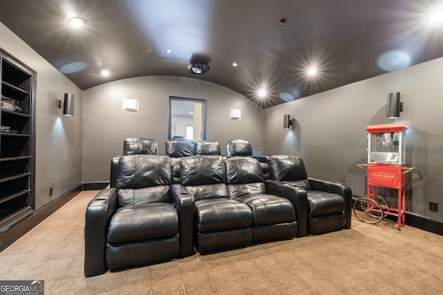 home theater room featuring recessed lighting, baseboards, built in features, and vaulted ceiling