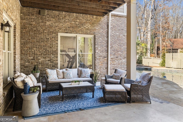 view of patio / terrace with fence and an outdoor hangout area