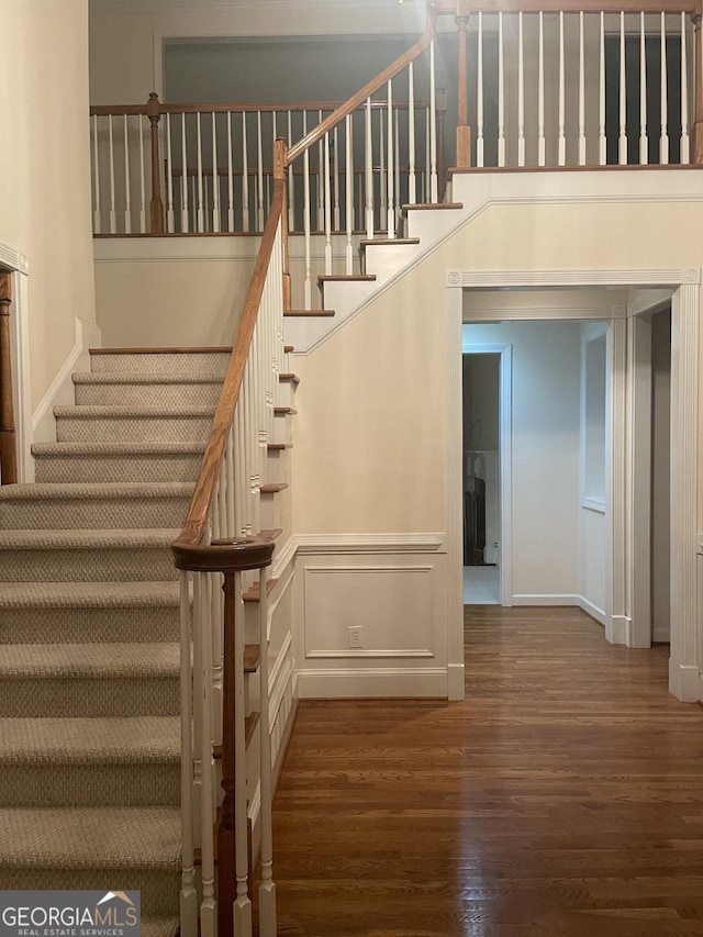 stairs with wood finished floors