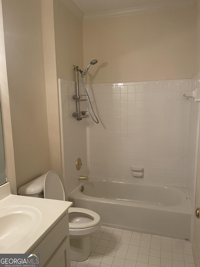 bathroom with tile patterned flooring, toilet, vanity, tub / shower combination, and crown molding