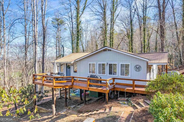 153 Coleman Heights Ln, Rabun Gap, GA 30568 - rear view of house with a shingled roof and a wooden deck