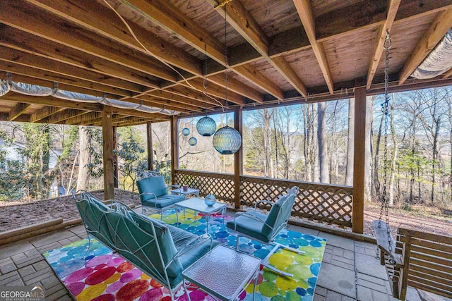 wooden terrace featuring a patio area and an outdoor hangout area