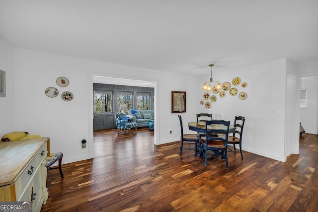 153 Coleman Heights Ln, Rabun Gap, GA 30568 - dining space featuring dark wood-type flooring and a chandelier