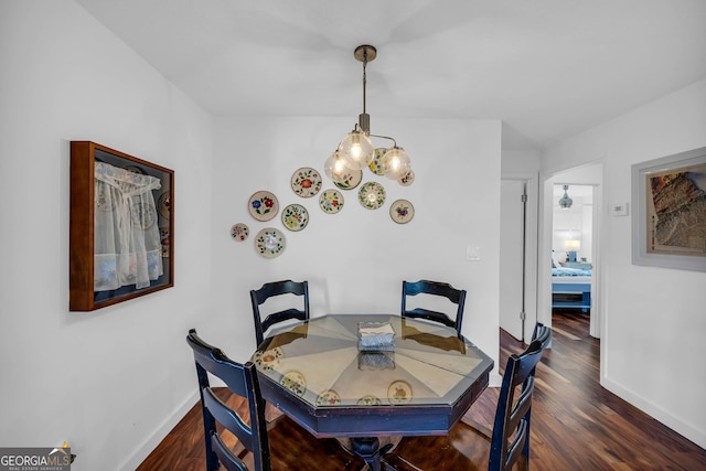 153 Coleman Heights Ln, Rabun Gap, GA 30568 - dining area featuring a chandelier and dark wood-style floors