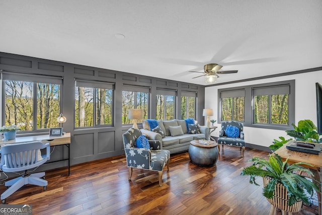 sunroom / solarium featuring ceiling fan and a wealth of natural light