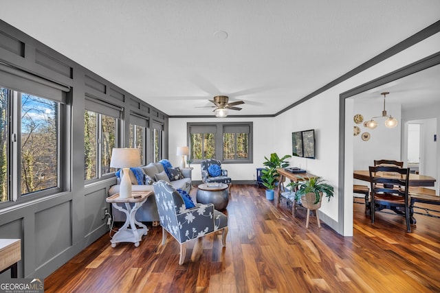 153 Coleman Heights Ln, Rabun Gap, GA 30568 - living room featuring plenty of natural light, wood finished floors, ceiling fan, and ornamental molding