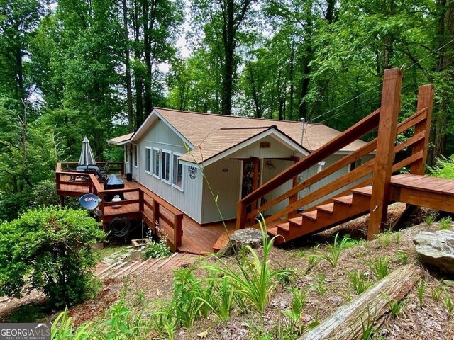 153 Coleman Heights Ln, Rabun Gap, GA 30568 - back of property featuring a shingled roof and a deck