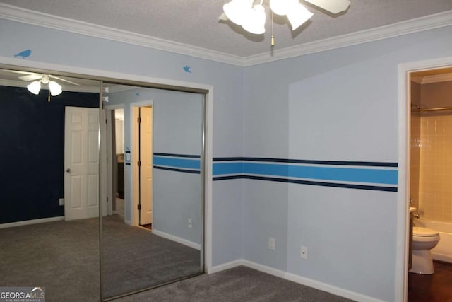 spare room with carpet, baseboards, and crown molding