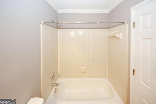 bathroom with crown molding, toilet, vanity, shower / bath combination, and tile patterned flooring