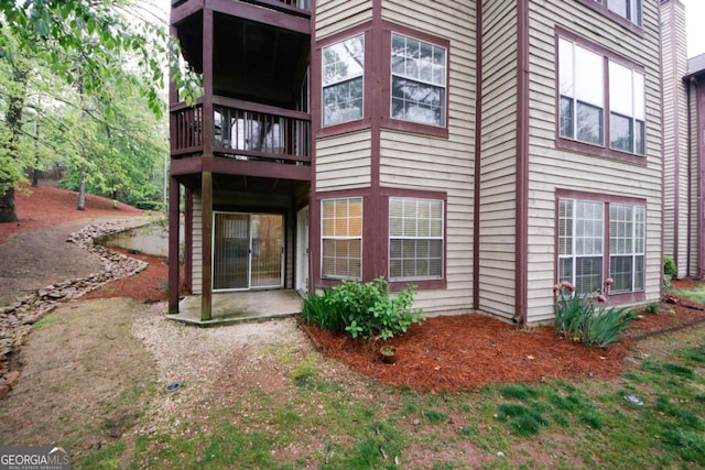711 Cypress Pointe St, Johns Creek, GA 30022 - view of home's exterior featuring a patio and a balcony