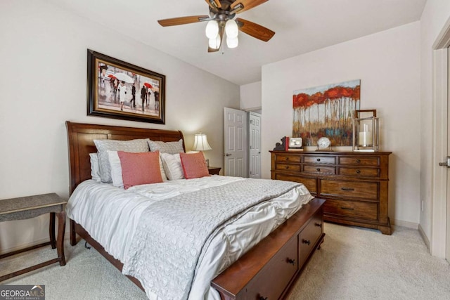 bedroom with light carpet, ceiling fan, and baseboards