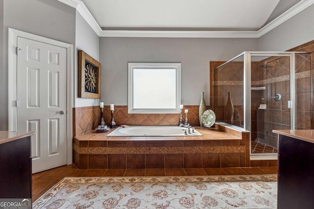 full bath with a bath, a stall shower, vaulted ceiling, and crown molding