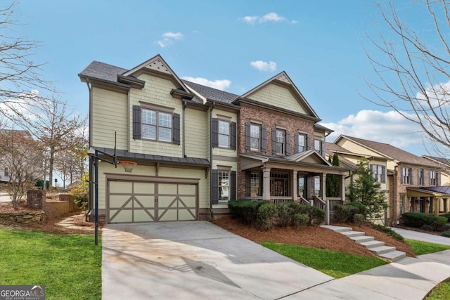 view of front of home with a garage, concrete driveway, and covered porch