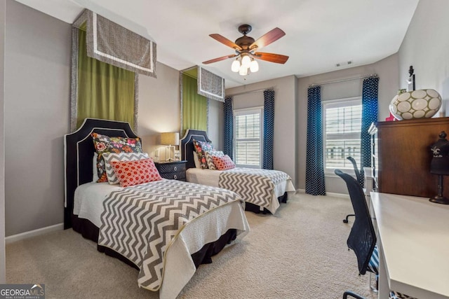 bedroom featuring a ceiling fan, carpet flooring, and baseboards