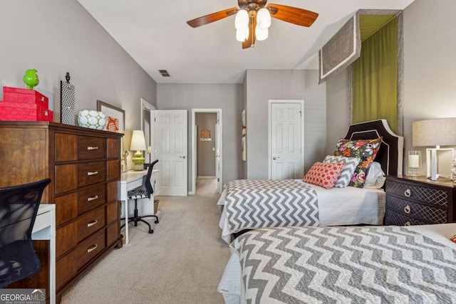 bedroom featuring light carpet, ceiling fan, and visible vents