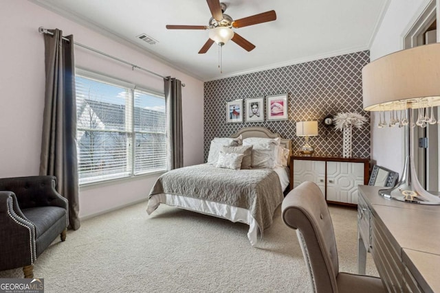 carpeted bedroom with wallpapered walls, baseboards, visible vents, and crown molding