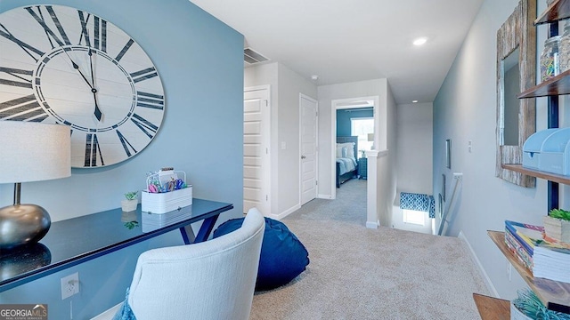 carpeted office space featuring recessed lighting, visible vents, and baseboards