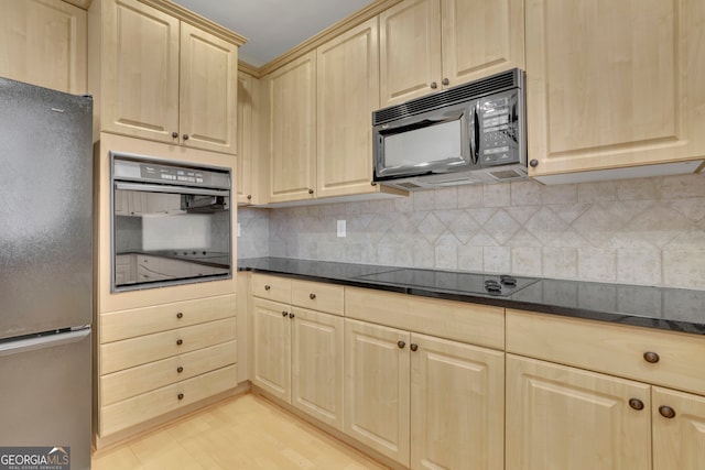 kitchen featuring decorative backsplash, light brown cabinets, black appliances, and light wood-type flooring