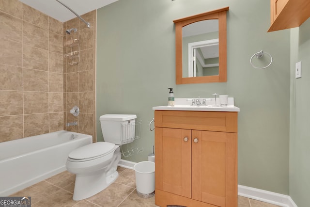 bathroom featuring baseboards, shower / washtub combination, toilet, tile patterned floors, and vanity