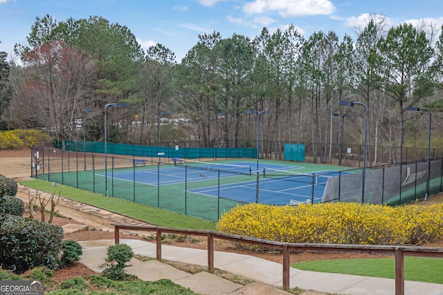 view of tennis court with fence