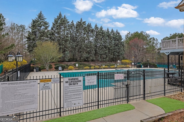 community pool with fence