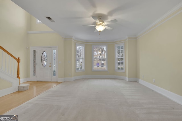 foyer entrance with stairway, plenty of natural light, and baseboards