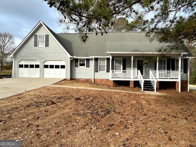 view of front of house featuring roof with shingles, covered porch, concrete driveway, crawl space, and a garage