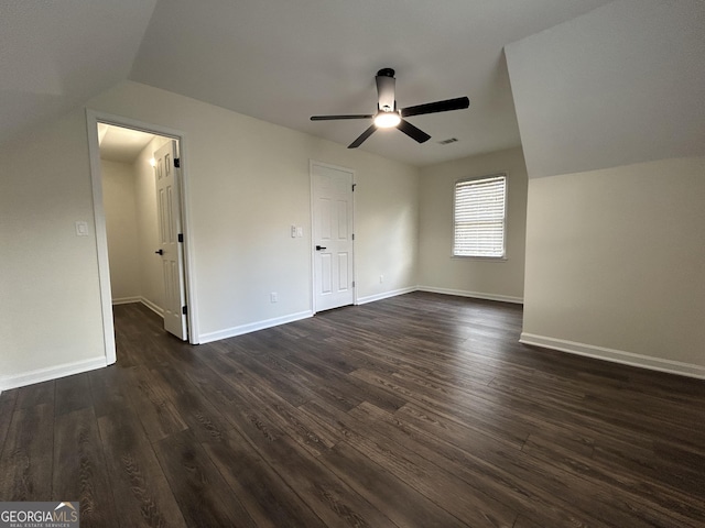 unfurnished bedroom with visible vents, baseboards, ceiling fan, and dark wood-style flooring