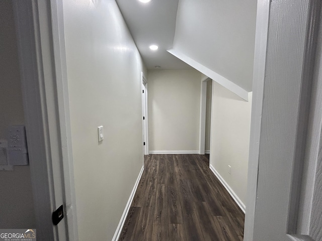 hall featuring recessed lighting, dark wood finished floors, and baseboards